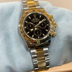 PRE-OWNED ROLEX 116503 DAYTONA BLACK DIAL OYSTER GOLD STAINLESS STEEL WITH CERT YEAR 2021