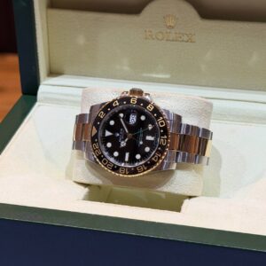 PRE-OWNED ROLEX 116713LN GMT-MASTER II BLACK DIAL YG/SS BRACELET WITH CERT YEAR 2010