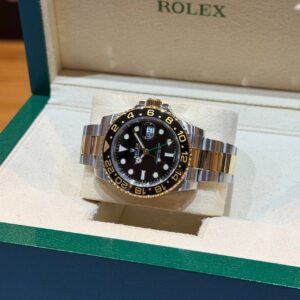 PRE-OWNED ROLEX 116713LN GMT-MASTER II BLACK DIAL YG/SS OYSTER BRACELET WITH CERT YEAR 2018