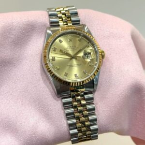 PRE-OWNED ROLEX 16233 DATEJUST-36 DIAMOND SET HOUR MARKERS GOLD DIAL JUBILEE GOLD STAINLESS STEEL BRACELET WITH CERT YEAR 1992