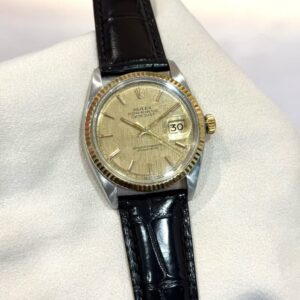 PRE-OWNED ROLEX 1601 DATEJUST-36 YELLOW GOLD INDEX DIAL BLACK LEATHER STRAP WATCH ONLY